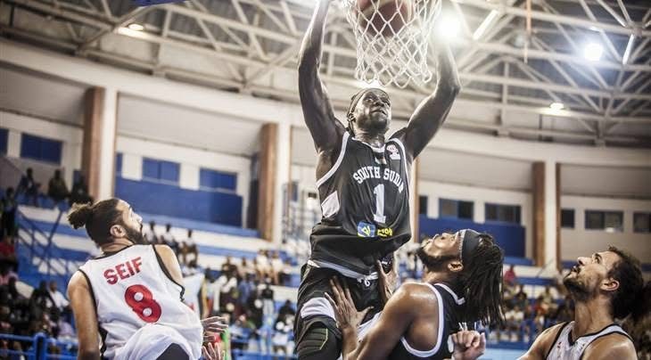 South Sudan basketball player reaching the hoop during a game